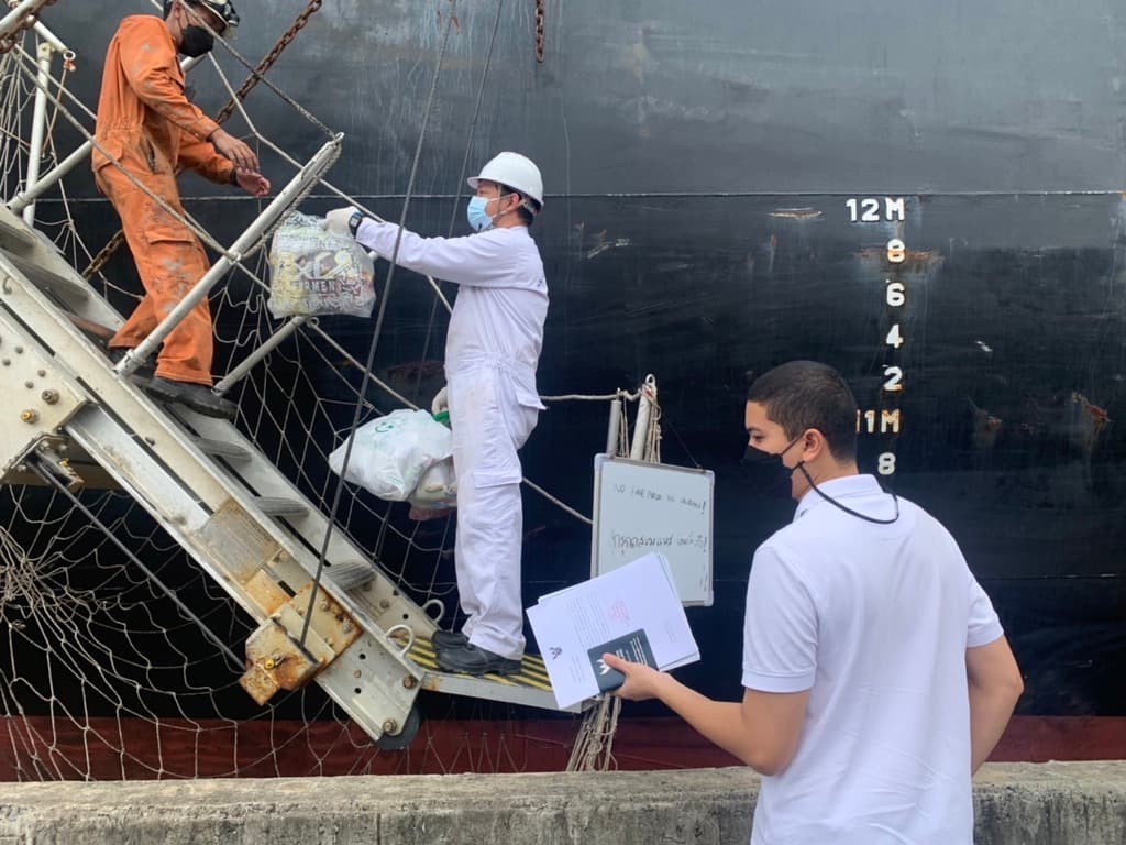 Crew boarding a cargo ship